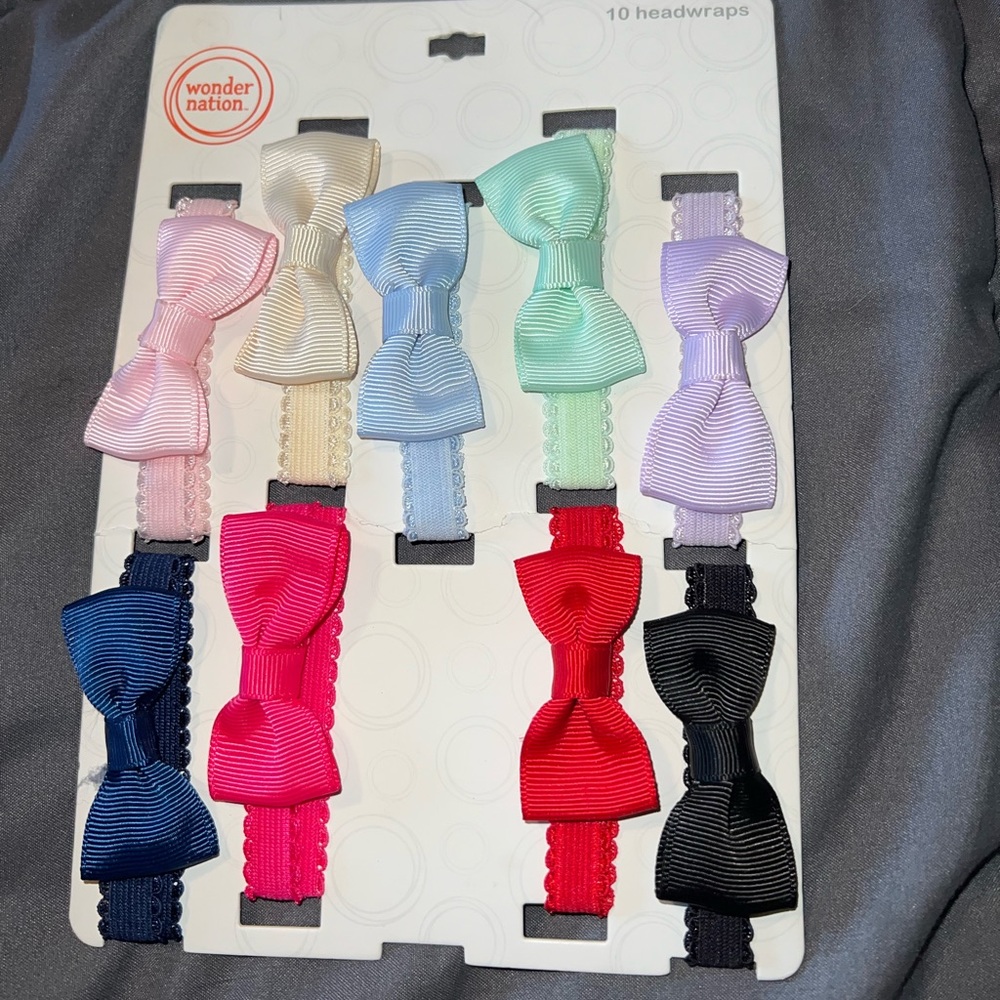New infant head bands. 1 missing